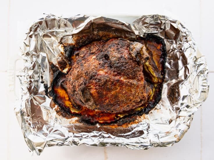 Mississippi pork roast in a foil lined roasting pan.