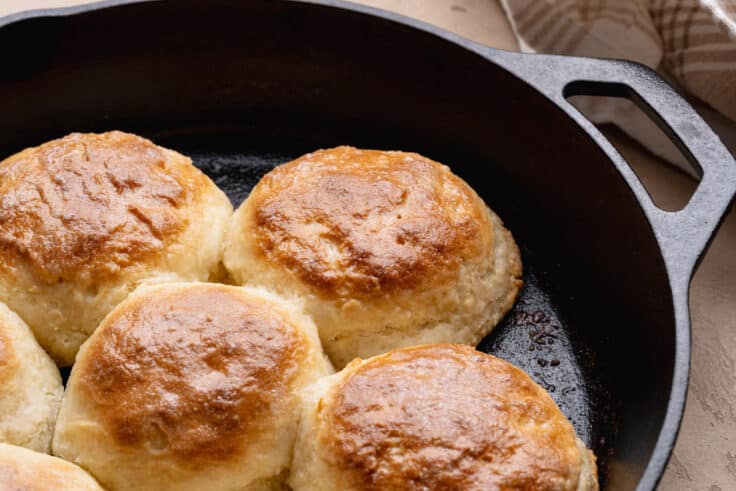 Horizontal shot of 7up biscuits in a cast iron skillet.