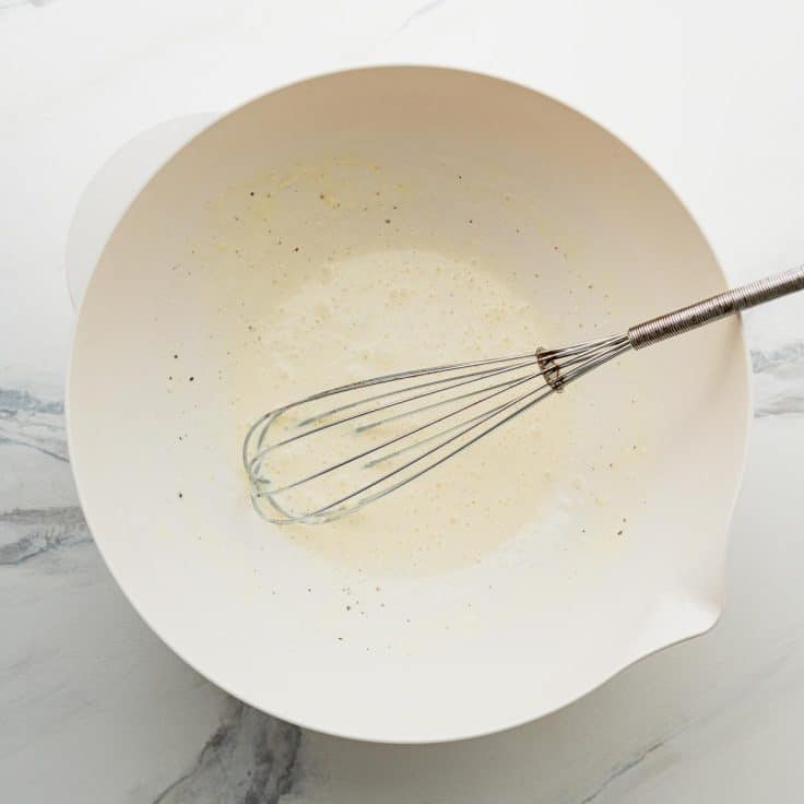 Whisking together the mayo dressing for a Hawaiian mac salad recipe.