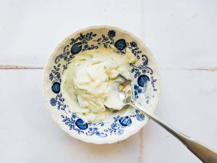Stirring together basil mayo.
