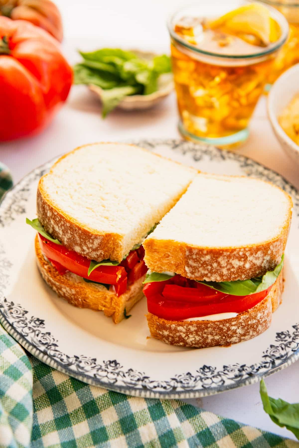 Side shot of a classic Southern tomato sandwich on a plate.