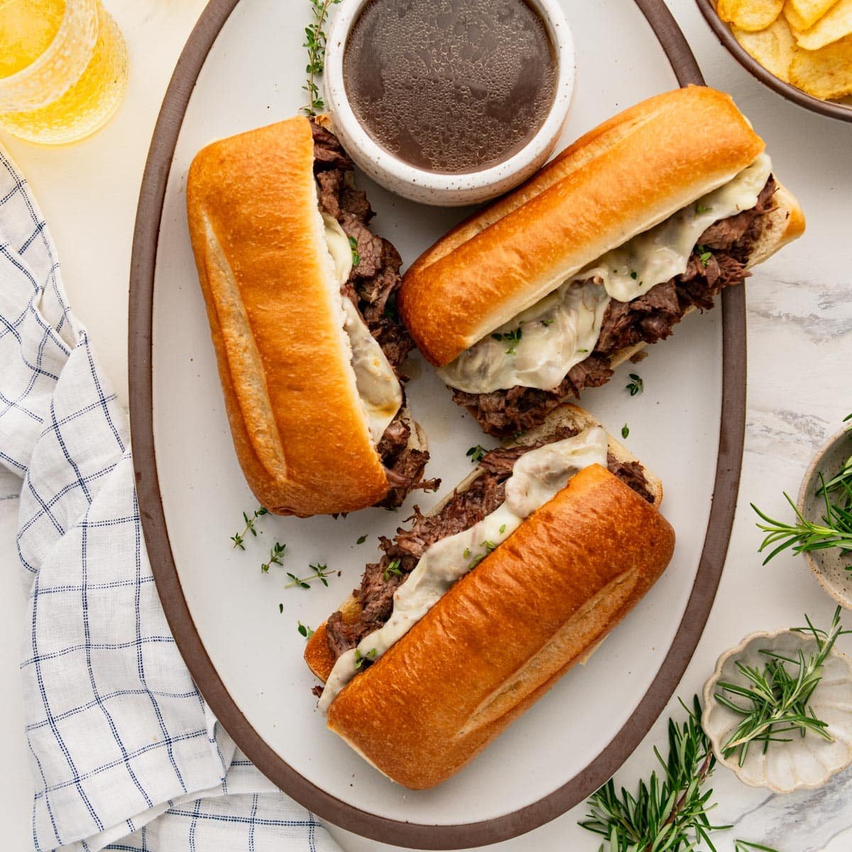 Square overhead shot of Crock Pot French dip sandwiches.
