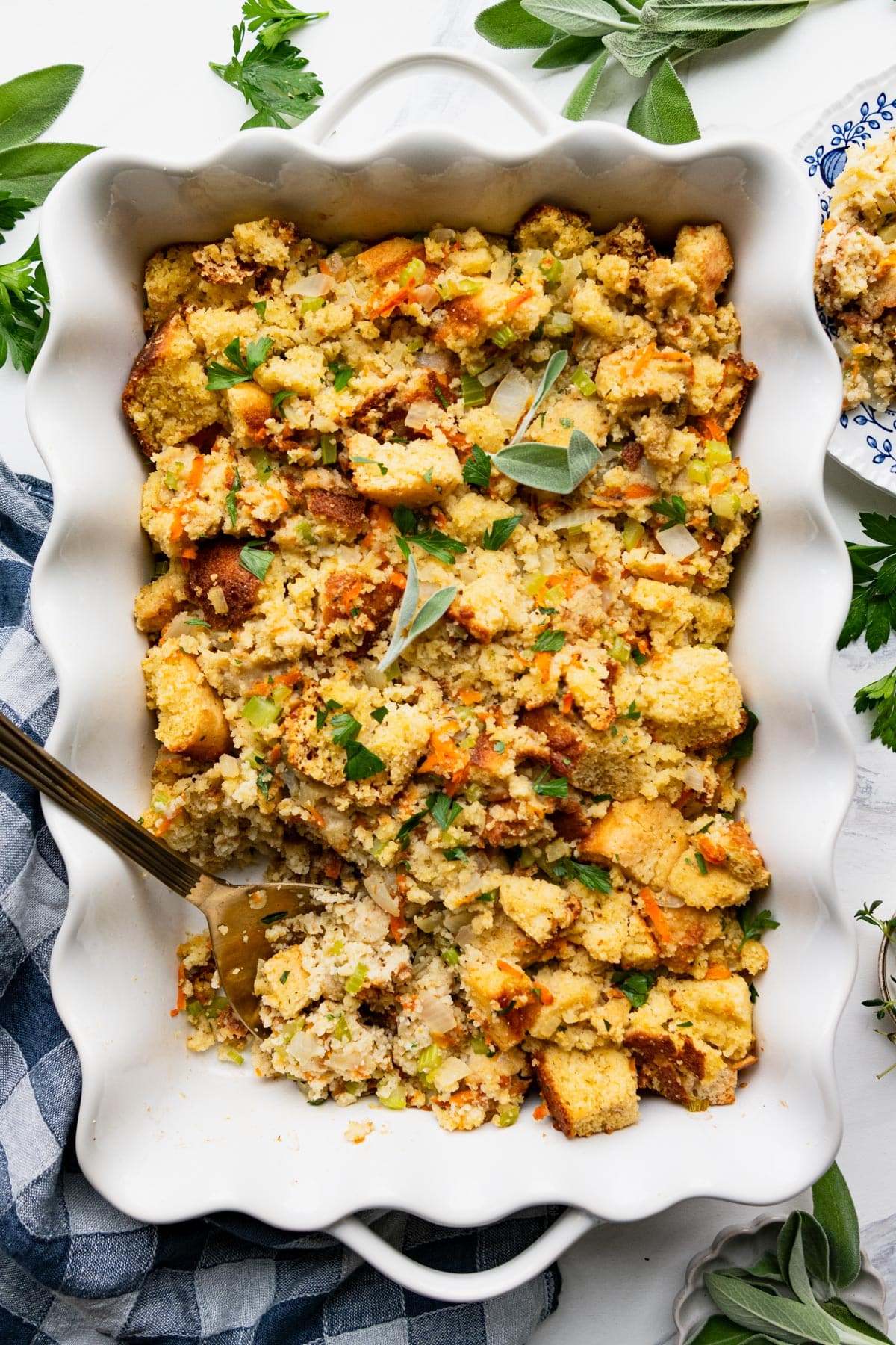 Overhead image of a white baking dish full of Southern cornbread dressing.