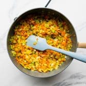 Sauteing the vegetables for a cornbread dressing recipe.