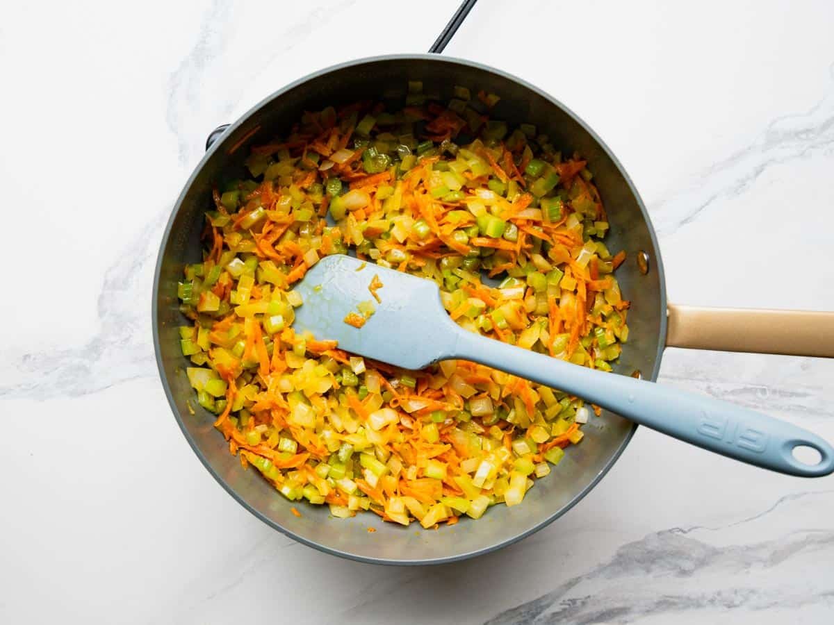 Sauteing the vegetables for a cornbread dressing recipe.