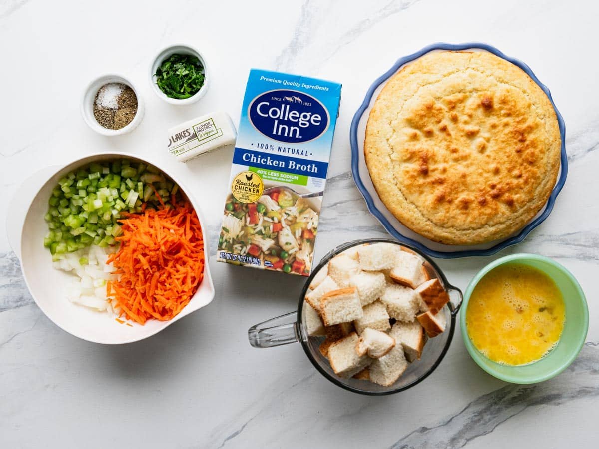 Southern cornbread ingredients on a white marble table.