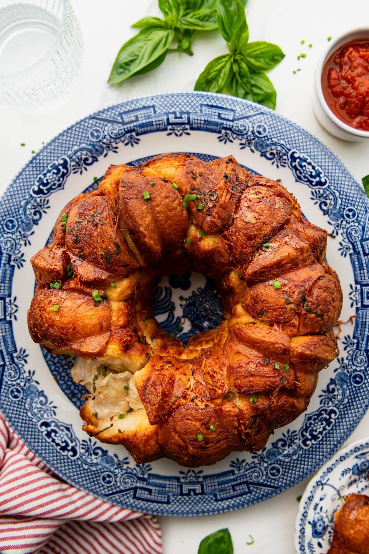 Overhead shot of pull apart garlic bread on a blue and white platter.