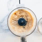 Pureed white beans in a small food processor.