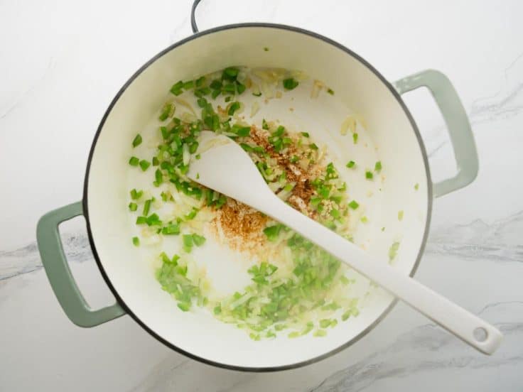 Sauteing aromatics for a white turkey chili recipe.