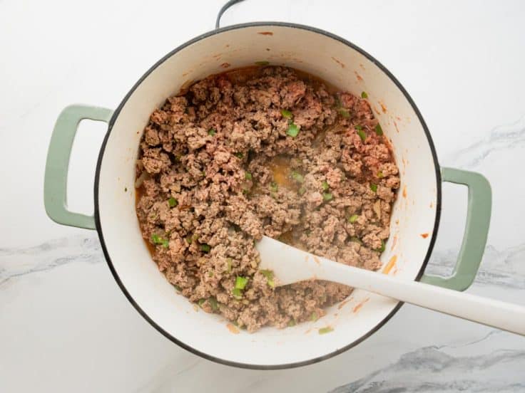Cooking ground turkey in a pot.
