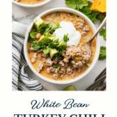 White turkey chili with a text title at the bottom.