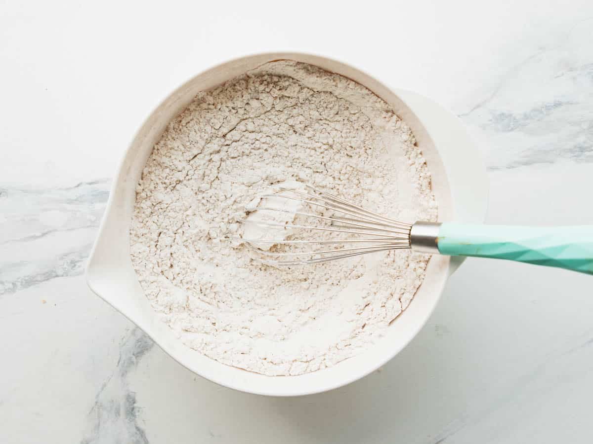 Whisking together dry ingredients.