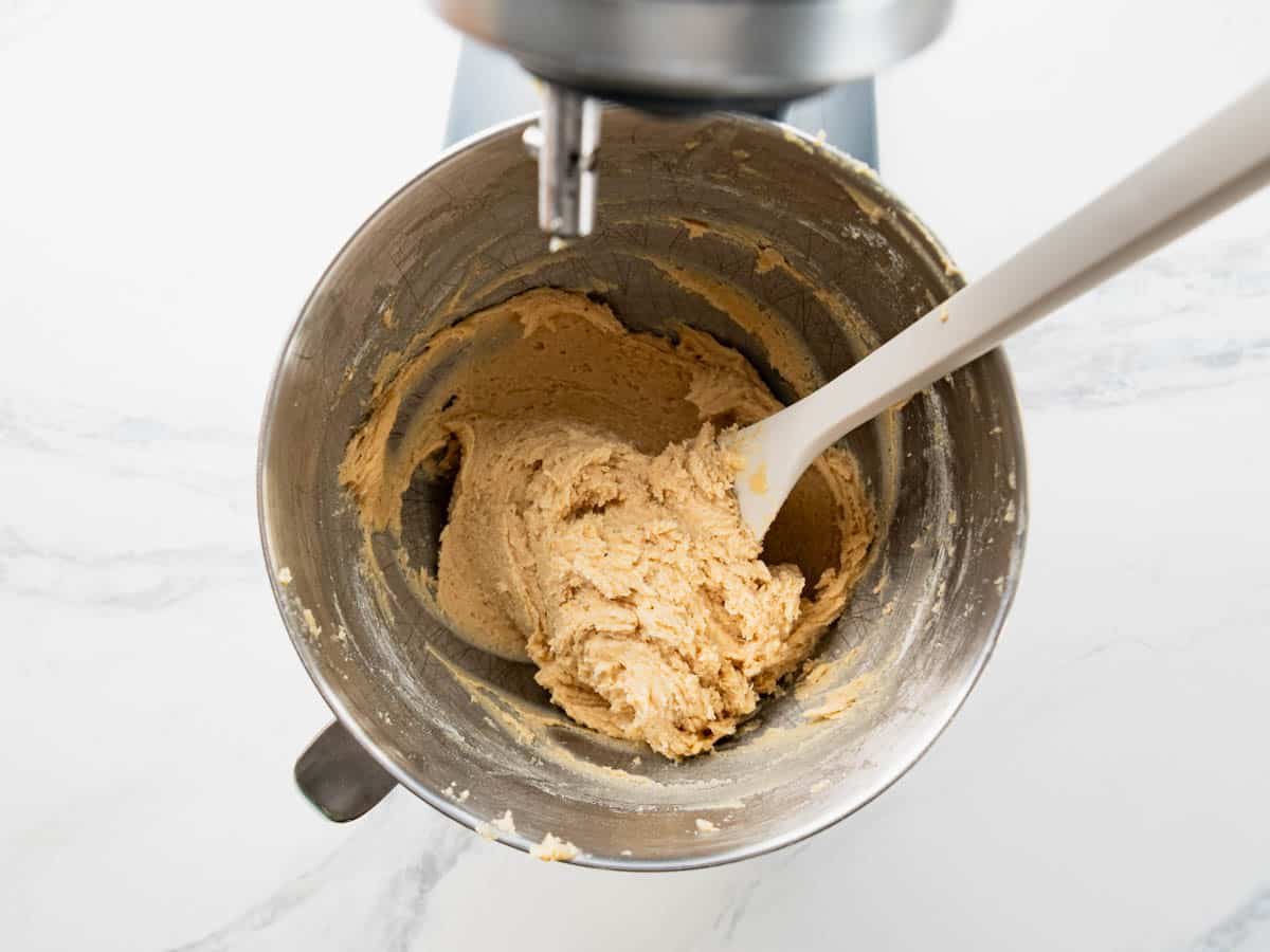 Cookie dough in a stand mixing bowl.