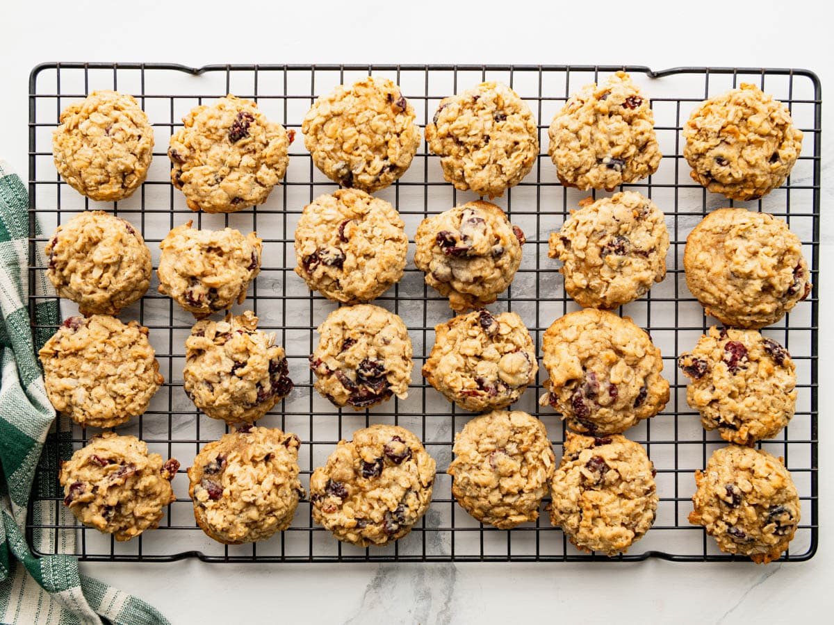 Overhead shot of cranberry oatmeal cookies cooling on a wire rack.