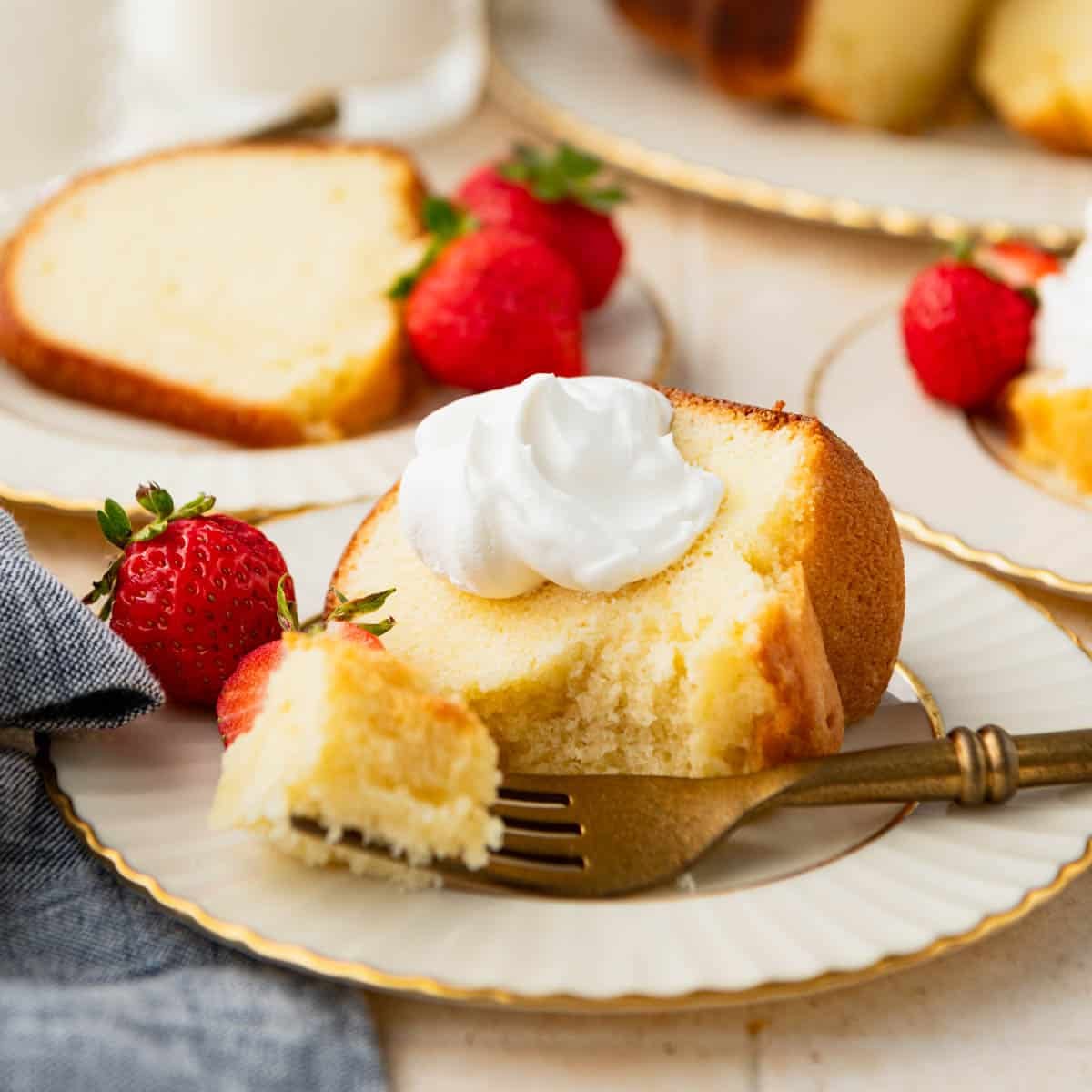 Square side shot of a bite of buttermilk pound cake on a fork.