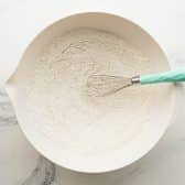 Whisking dry ingredients for a buttermilk pound cake recipe.