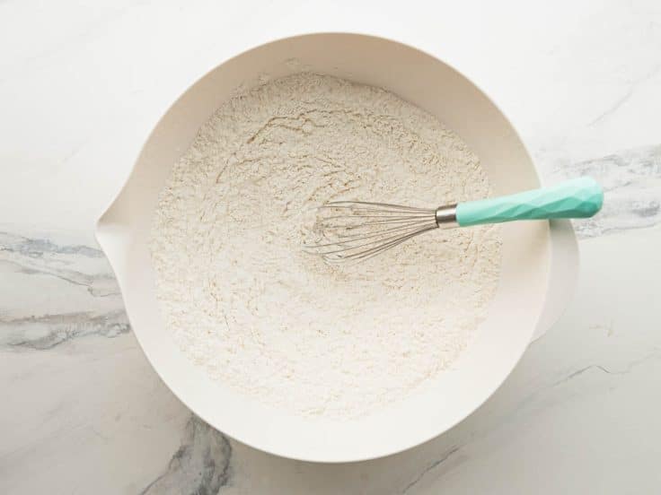 Whisking dry ingredients for a buttermilk pound cake recipe.