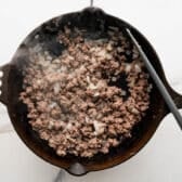 Browning ground beef with onion.