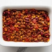 Chili spread in a casserole dish.