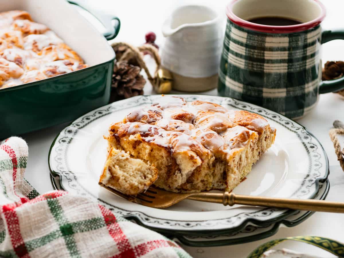 Horizontal shot of a slice of cinnamon roll casserole on a plate.
