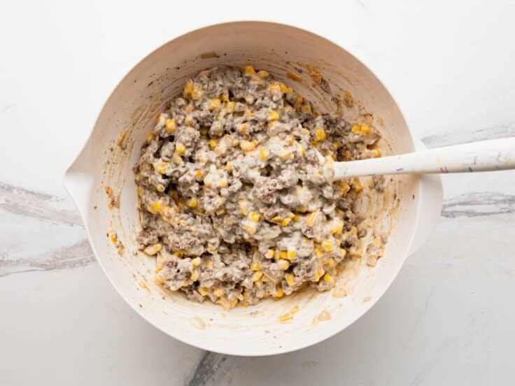 Stirring together the creamy beef filling.