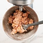 Cream cheese sausage ball mixture in a stand mixer bowl.