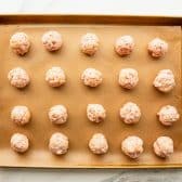 Cream cheese sausage balls on a baking sheet before they go in the oven.