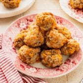 Square close up shot of a platter of cream cheese sausage balls.