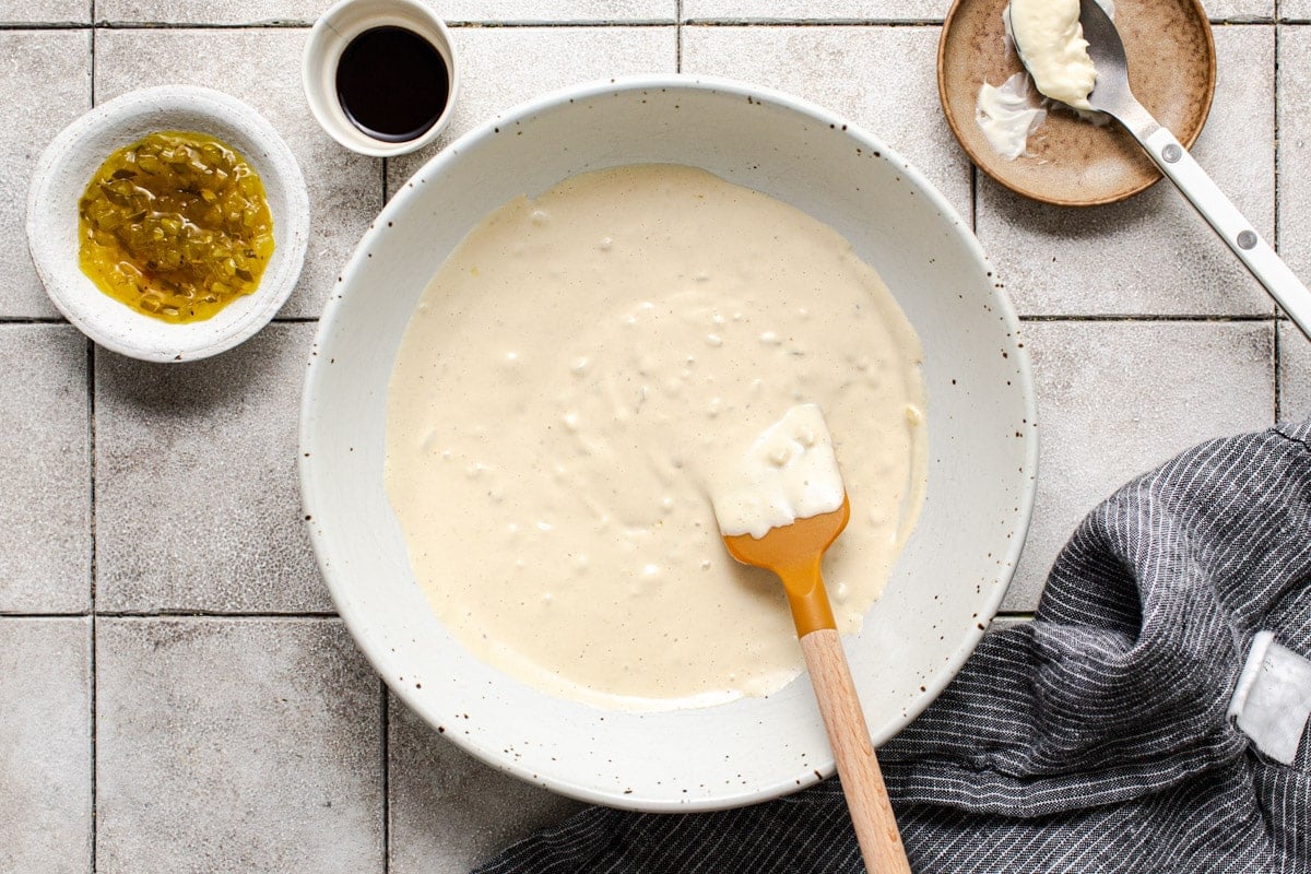 Making the sauce for a ham salad recipe.