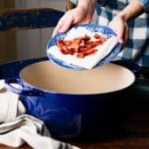 Cooking bacon in a Dutch oven for a southern hoppin john recipe.