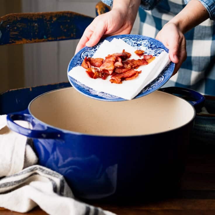 Cooking bacon in a Dutch oven for a southern hoppin john recipe.
