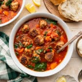 Horizontal overhead shot of two bowls of Italian style meatball soup.
