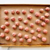 Rolling homemade meatballs.