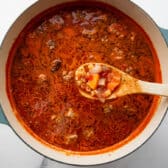 Cooking the pasta in meatball soup.
