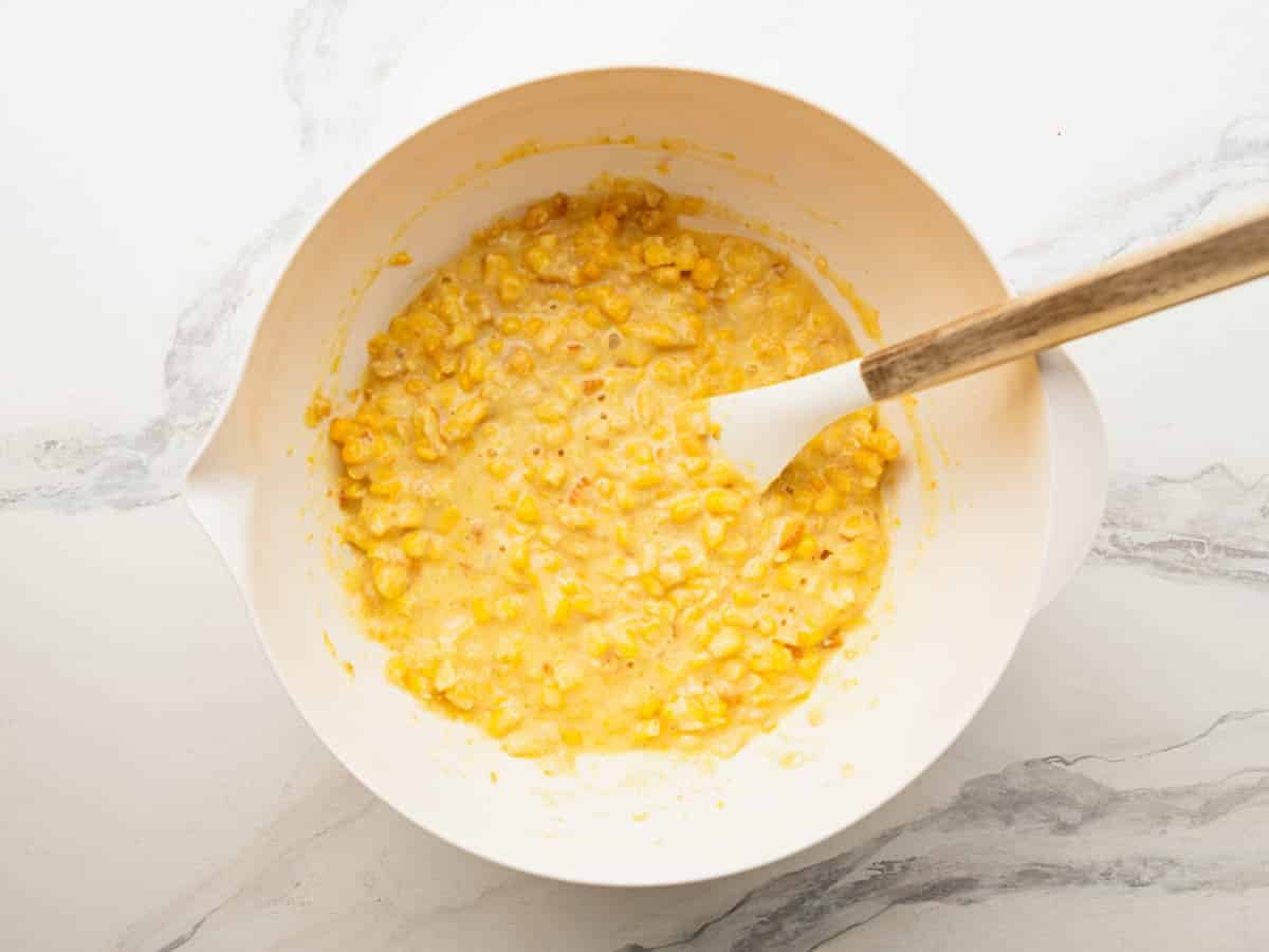 Stirring together ingredients for scalloped corn.