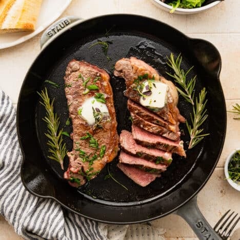 Square overhead shot of cast iron steak.