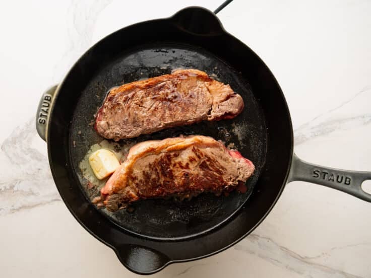 Adding the butter to the skillet.