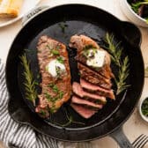 Horizontal overhead shot of cast iron steak.