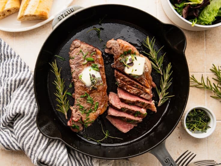 Horizontal overhead shot of cast iron steak.