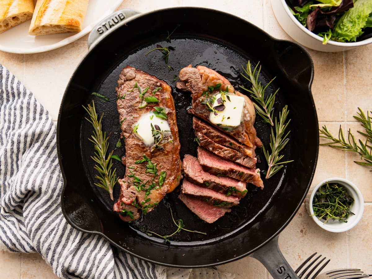 Horizontal overhead shot of cast iron steak.