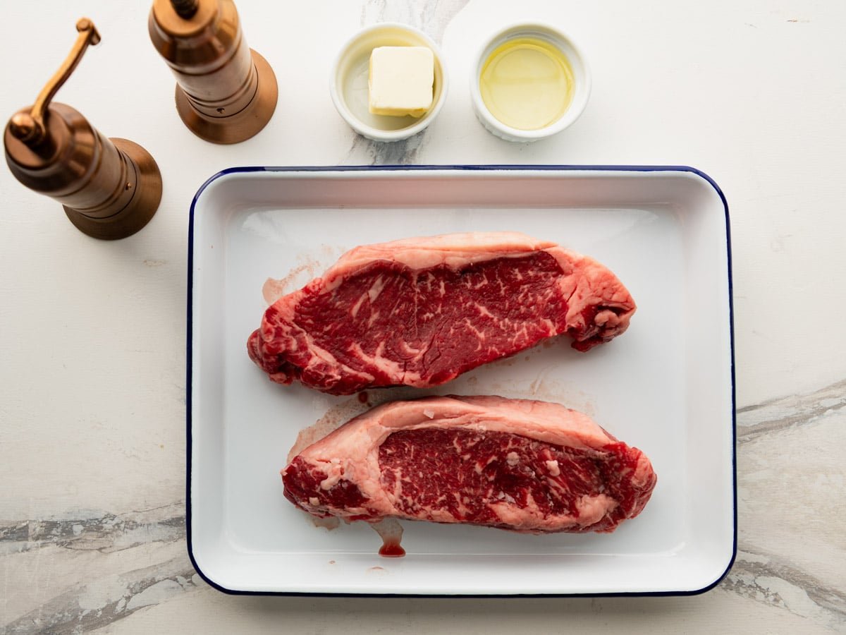 Ingredients for a cast iron skillet steak recipe.