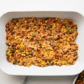 Meat filling in the bottom of the baking dish.