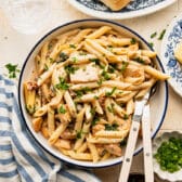 Horizontal overhead image of a bowl of Tuscan chicken pasta.