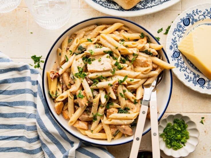 Horizontal overhead image of a bowl of Tuscan chicken pasta.