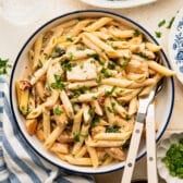 Square overhead shot of a bowl of creamy Tuscan chicken pasta.