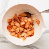 Diced chicken breast seasoned with paprika, salt, and pepper.