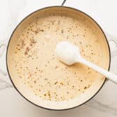 Melting the Parmesan into the cream sauce.