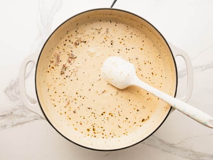 Melting the Parmesan into the cream sauce.