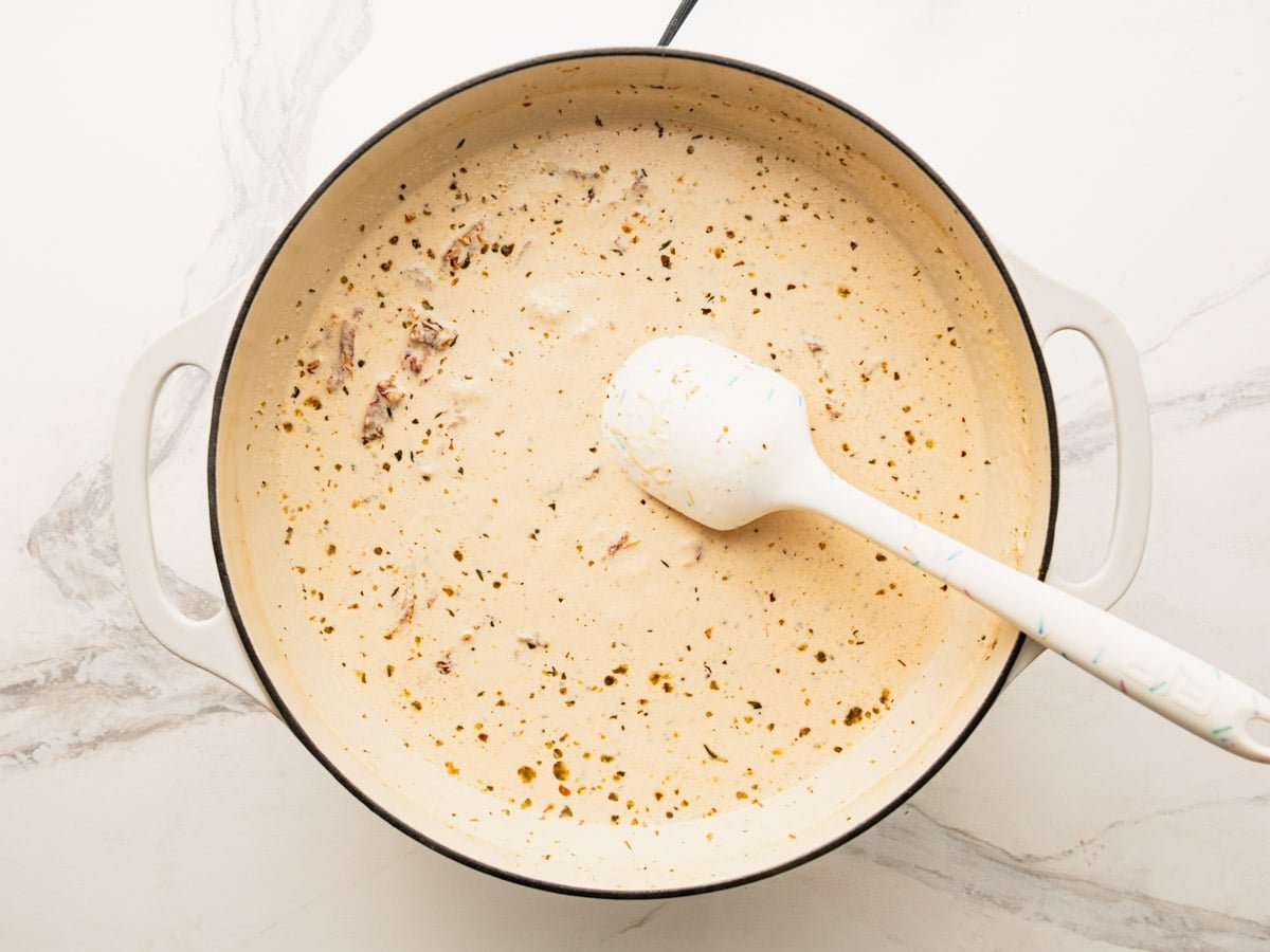 Melting the Parmesan into the cream sauce.