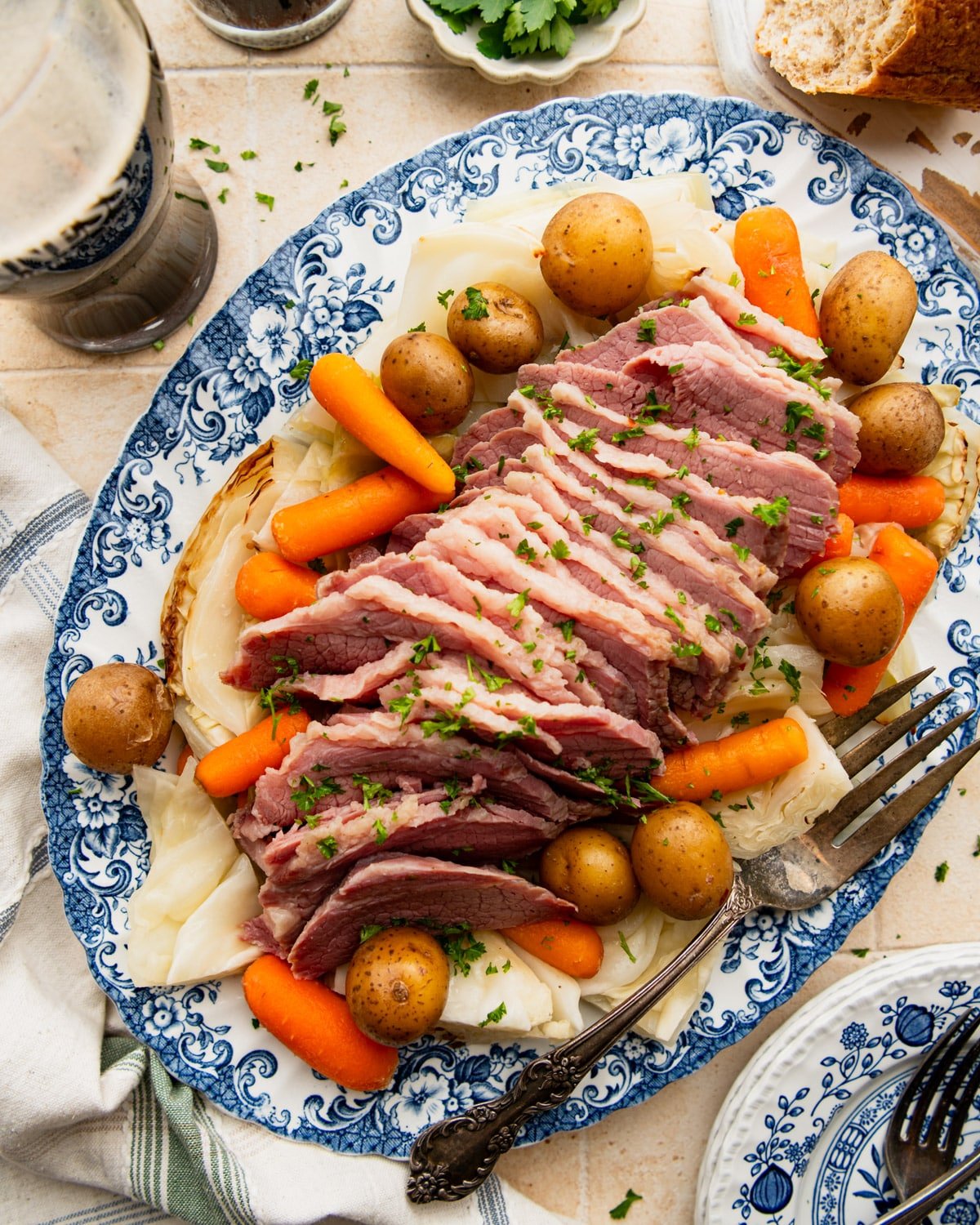 Overhead shot of a platter full of slow cooker corned beef and cabbage with veggies.